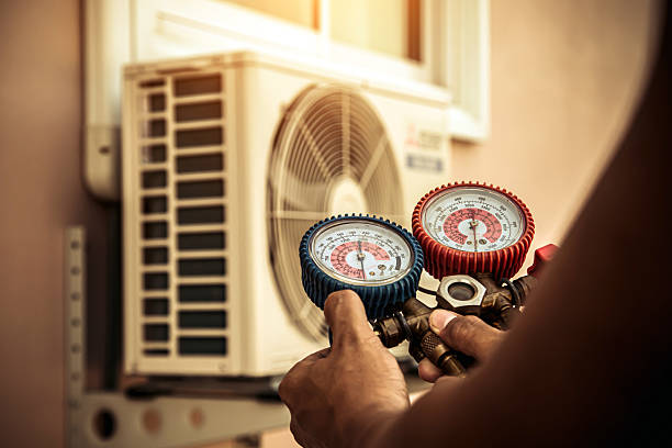 Professional Air Conditioning Service technician working in Canton, MA